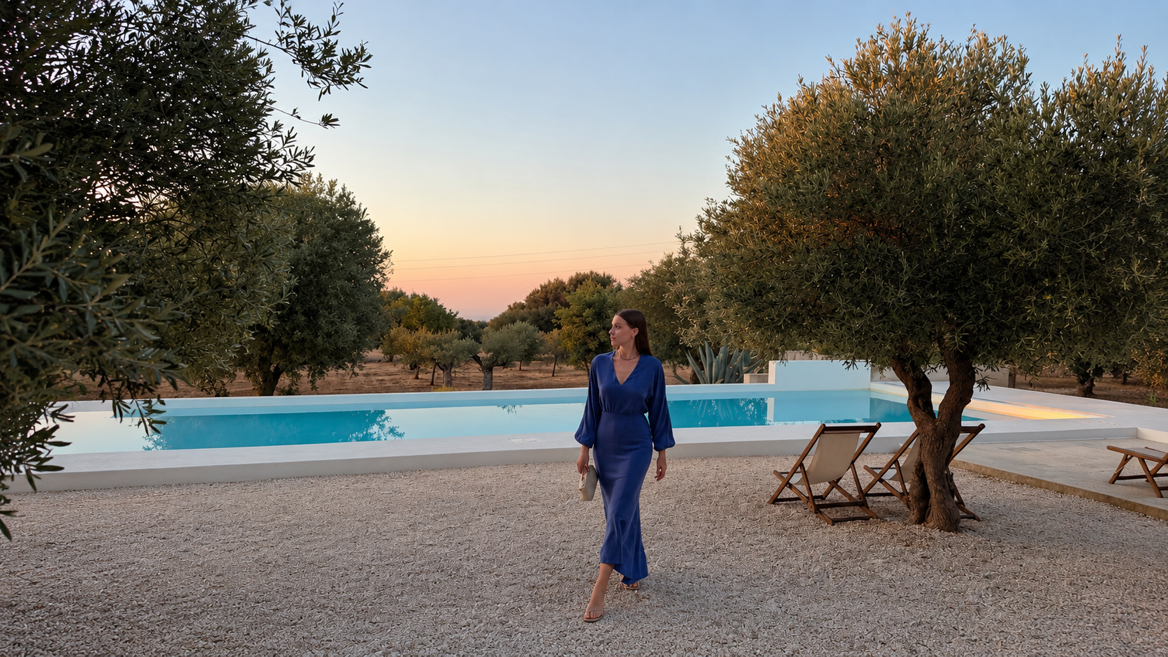 Kira at sunset by the pool among the olive trees