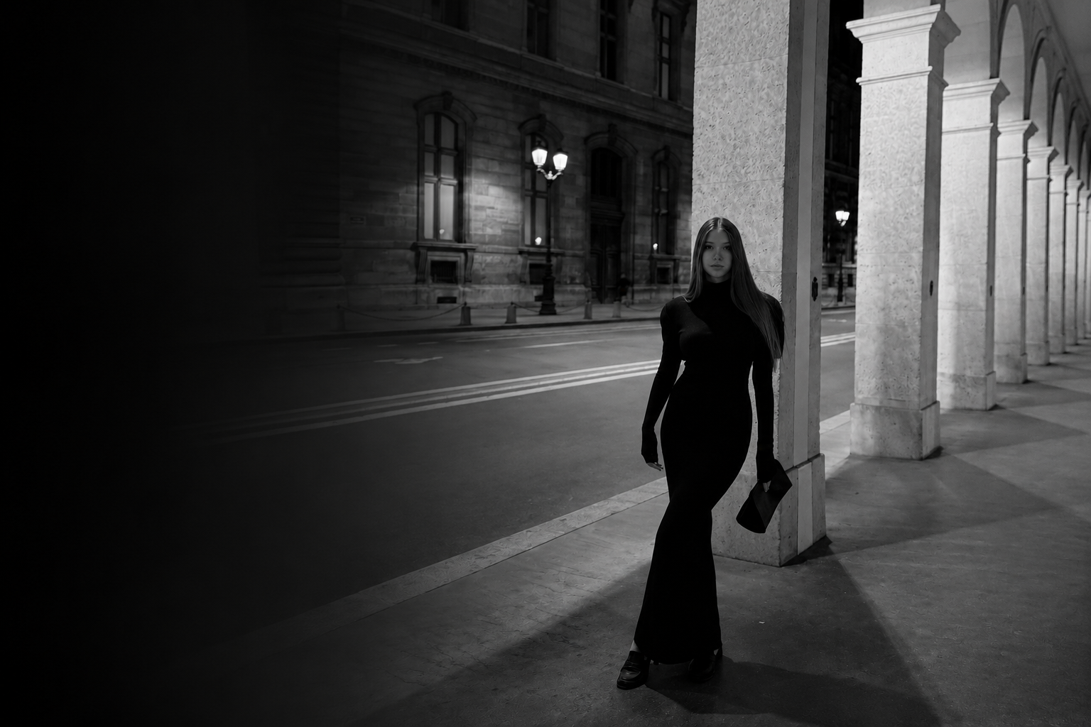 Kira Yafimava — black and white night portrait beneath the stone arcade